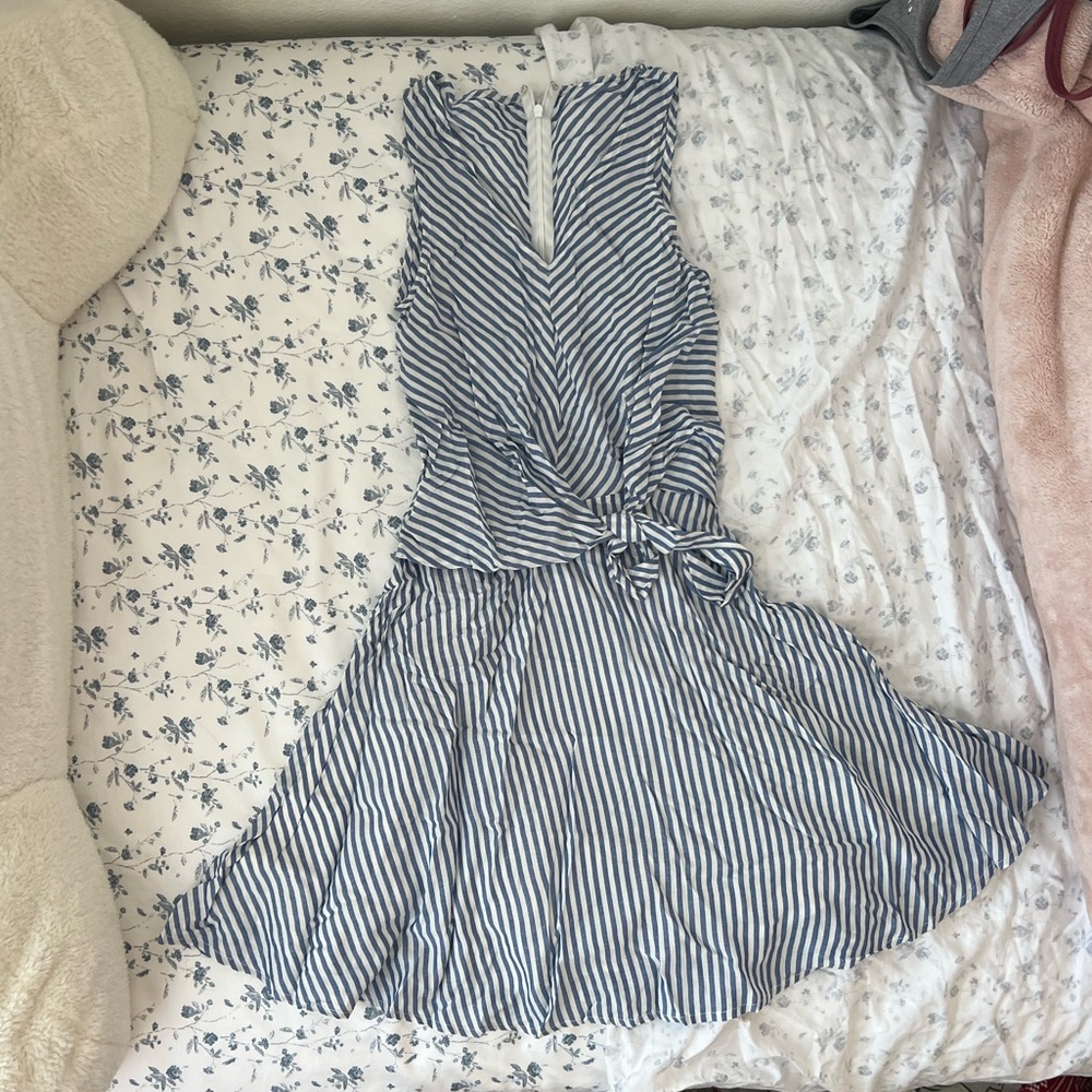 white/light blue dress, slightly altered, tied bow on left side, layered